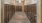 a hallway with wooden cabinets