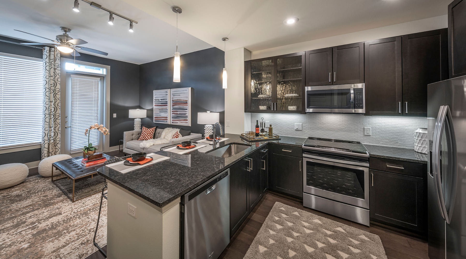 Settle into comfort at The Lyla a kitchen with black cabinets