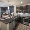 a kitchen with black cabinets