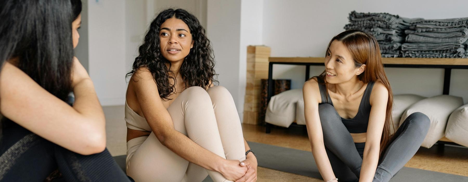 a group of women sitting on the floor